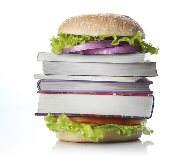 Picture of burger with books in the center of it.